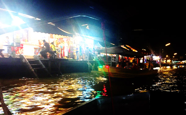 Amphawa Klong at Night. Boats heading off with tourists to see the fireflies